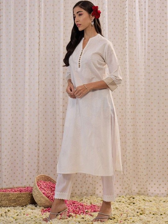 Straight kurta with a subtle gold striped print accents.