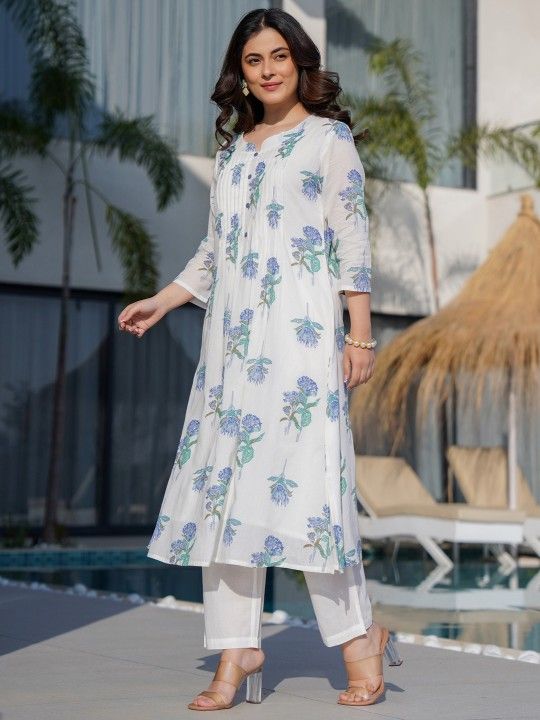 Mul cotton kurta set with a delicate blue and green floral print.